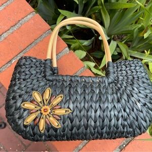 Elegant Black Woven Handbag with Floral Beaded Accent Flower